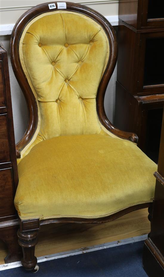 A Victorian mahogany spoonback nursing chair